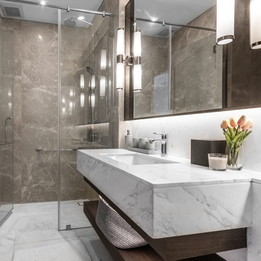 Clean and white bathroom with amenities, The room is decorated w Clean and white bathroom with amenities, The room is decorated w